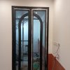 Cửa đi mở quay 2 cánh uốn vòm cách điệu