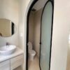 Cửa uốn vòm 1 cánh mở kính mờ